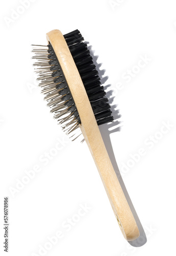 Wooden brush for animals on a white isolated background