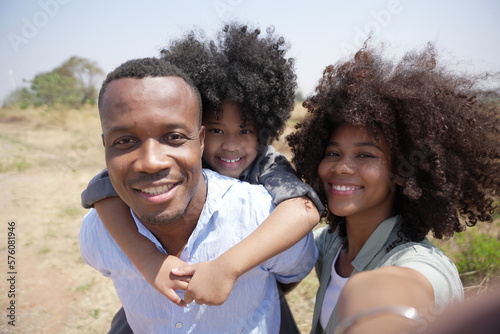 Portrait of african american family taking a selfie together. Young couple enjoying family time with children