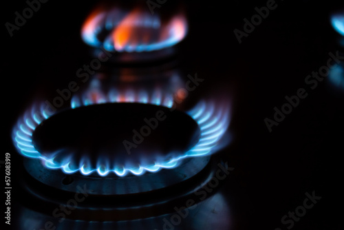 A gas burner with blue flames in the dark © Alexandr Macovethi