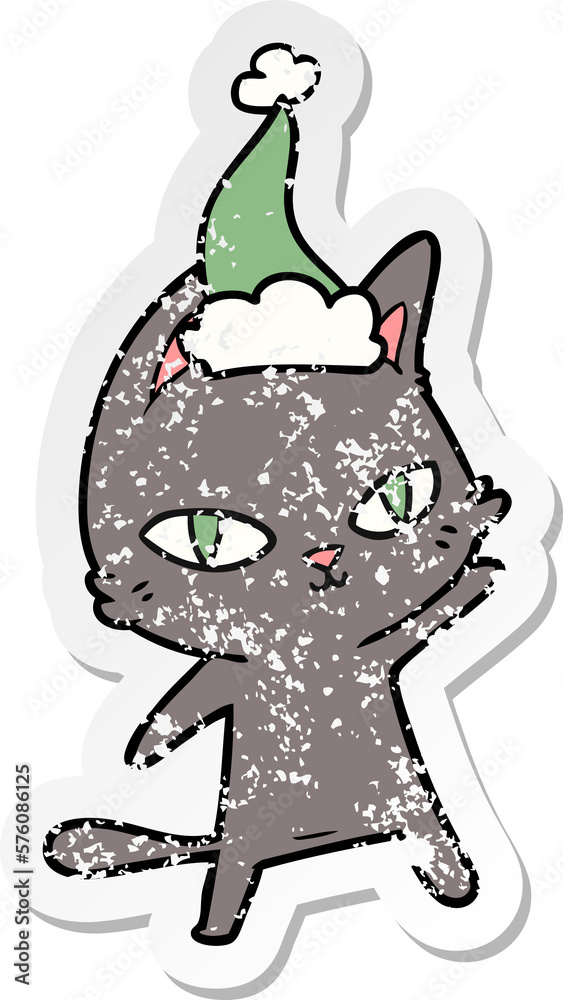 distressed sticker cartoon of a cat staring wearing santa hat distressed sticker cartoon of a cat staring wearing santa hat