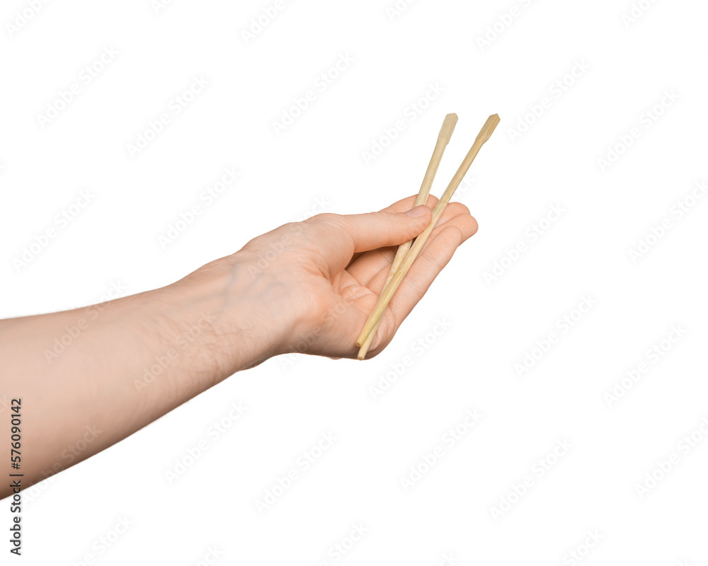 Bamboo sticks for sushi in male hand, isolate Bamboo sticks for sushi in male hand, isolate