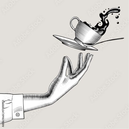 Foto Woman's hand and flying Coffee cup with a splashed coffee or tee, dish and spoon