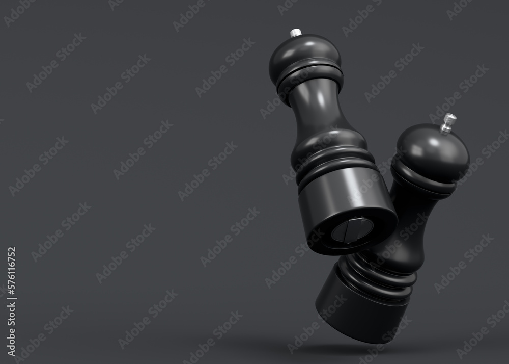 Set of salt or pepper wooden mill filled with peppercorns on monochrome black Set of salt or pepper wooden mill filled with peppercorns on monochrome black