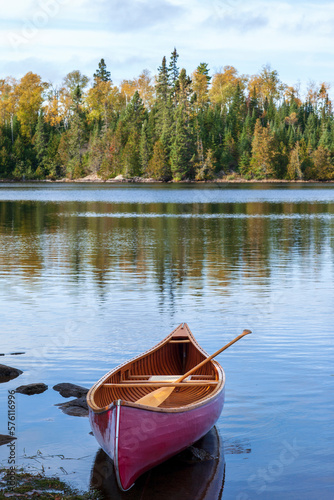Fototapeta Naklejka Na Ścianę i Meble -  Wooden canoe near shore of Boundary Waters lake in Minnesota on an autumn morning