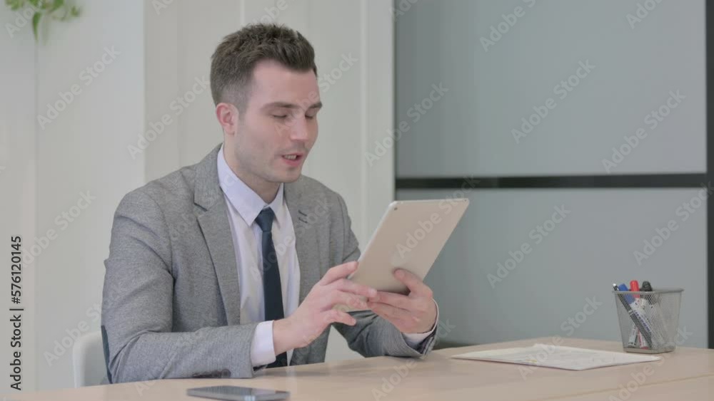 Online Video Chat on Tablet by Young Businessman