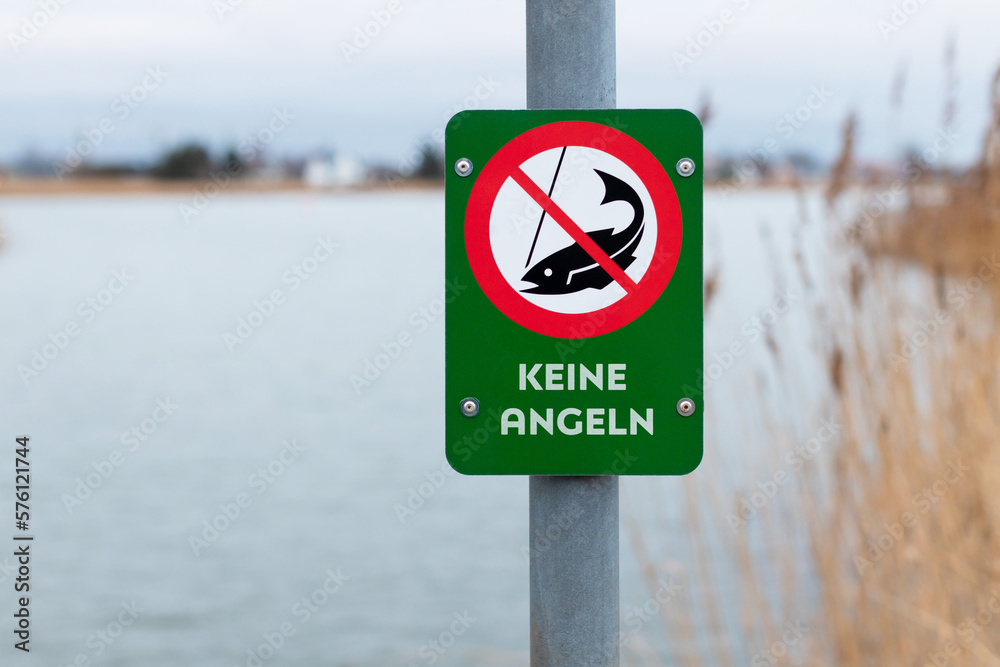 German fishing prohibited sign near lake - NO FISHING German fishing prohibited sign near lake - NO FISHING