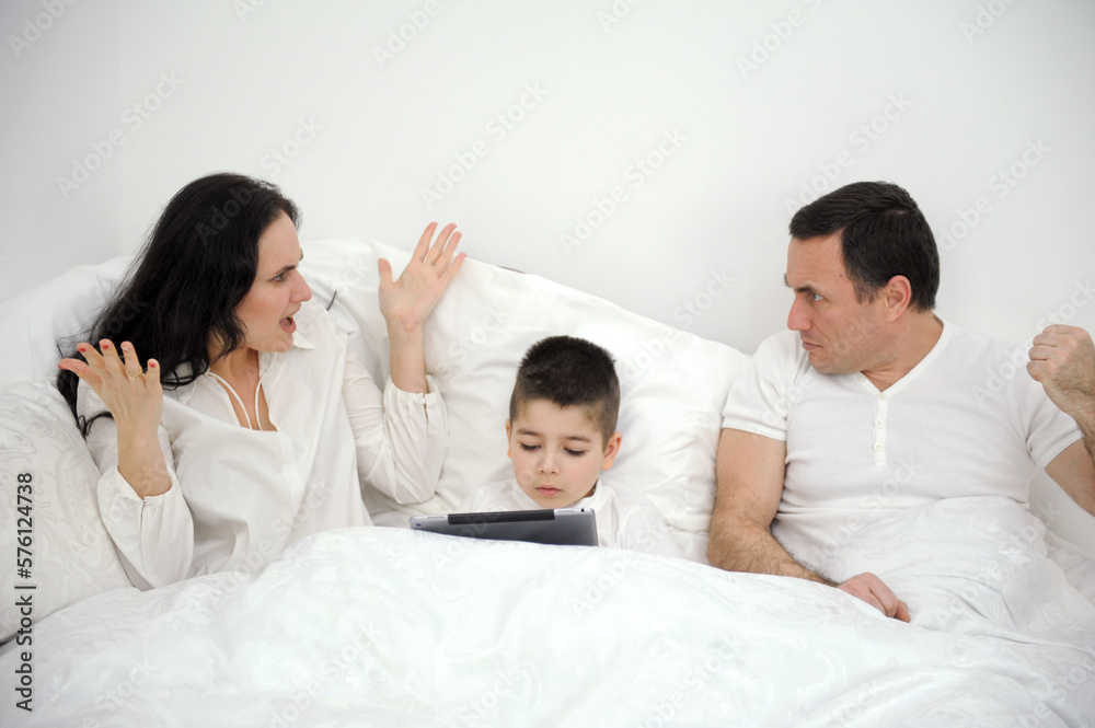 mother and father quarreling with child son holding tablet ignoring children Couple fight, sad divorce and angry communication in bedroom, stress about erectile dysfunction and mental health problem
