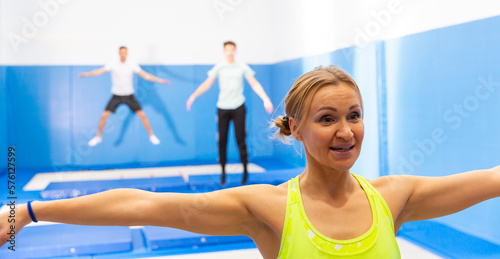 Close up portrait of athletic woman training in indoor trampolines center