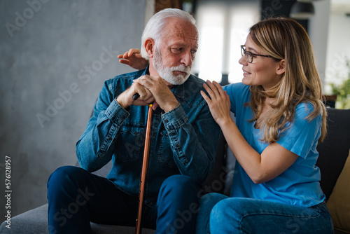 Cuadro en lienzo Young nurse spend time with old man, shares his pain, express empathy caring abo