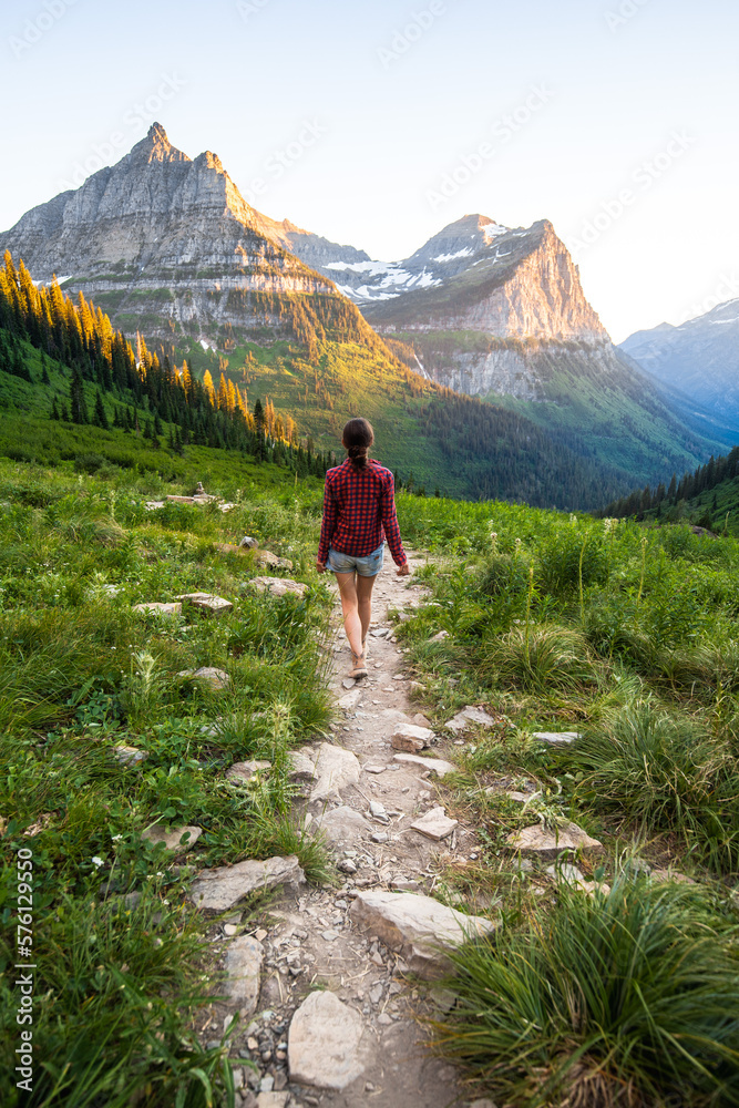 A girl follows the trail towards Mt Cannon and Mt Oberlin. Amazing view at the peak that rose against the clear sky from Paradise Meadow.