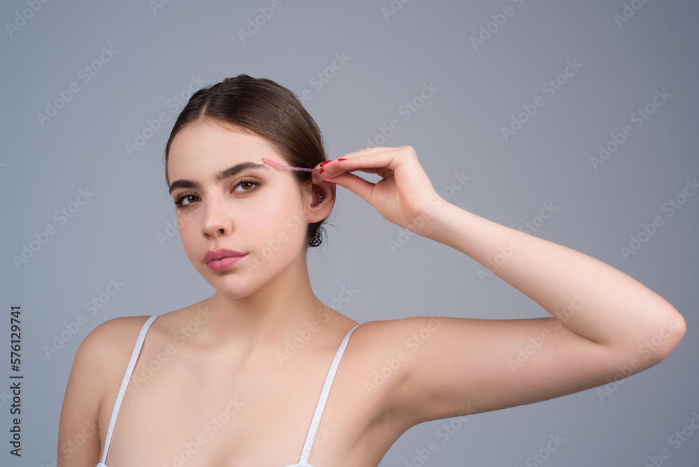 Beautiful woman with perfect shape eyebrows. Womans mascara brows close up. Beautiful girl with eyebrow brush. Eyebrow correction. Long eyelashes and thick eyebrows. Beautiful woman with perfect shape eyebrows. Womans mascara brows close up. Beautiful girl with eyebrow brush. Eyebrow correction. Long eyelashes and thick eyebrows.