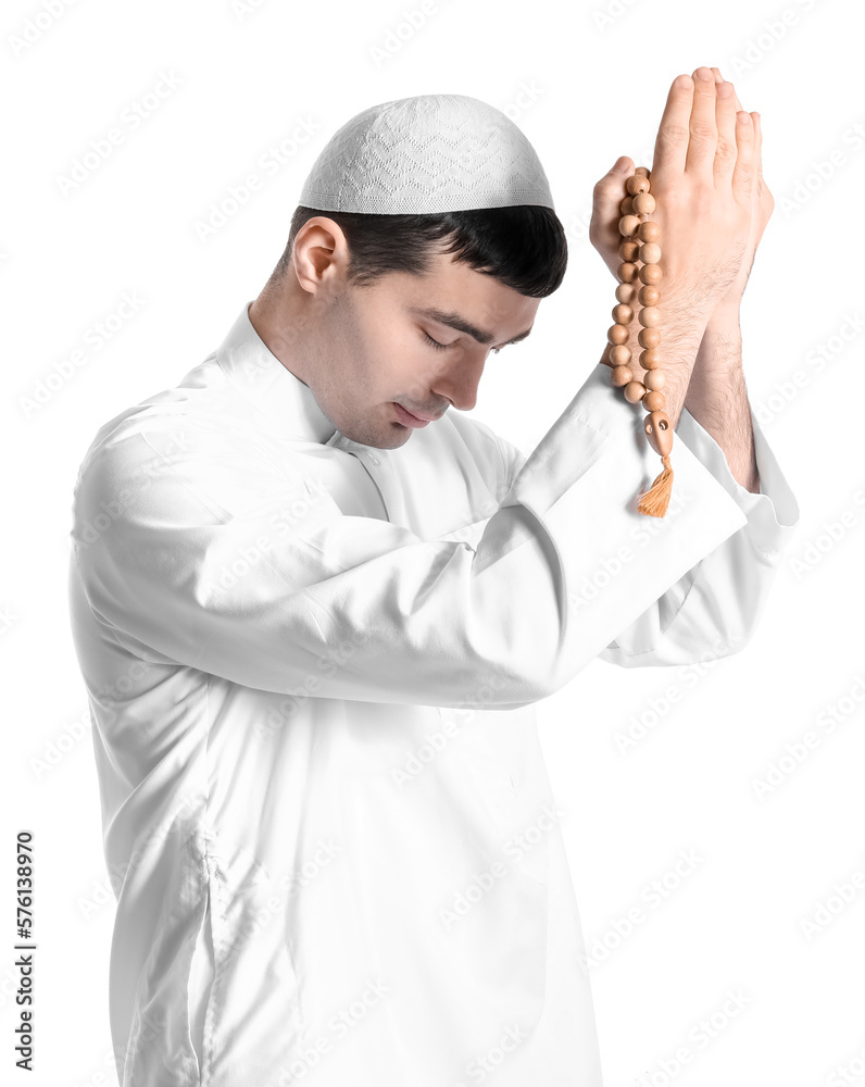 Praying Muslim man on white background