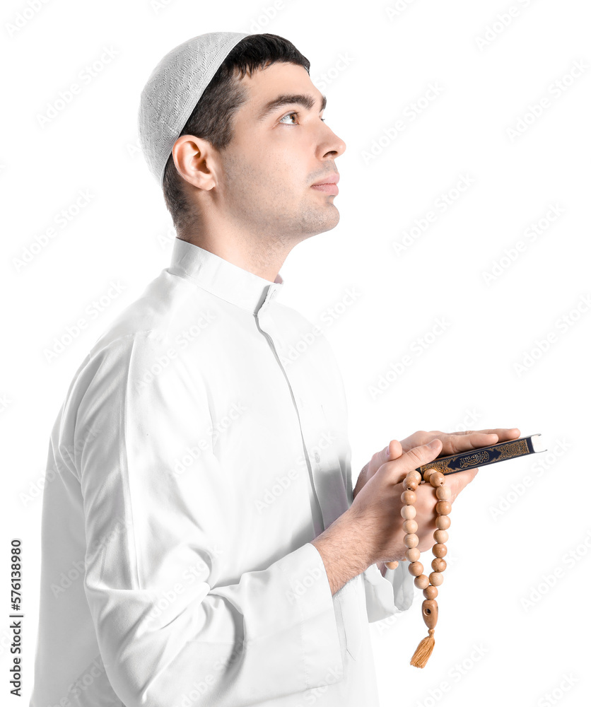 Praying Muslim man with Koran on white background Praying Muslim man with Koran on white background