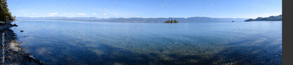 lake view panorama with calm blue sky