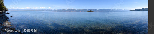 lake view panorama with calm blue sky