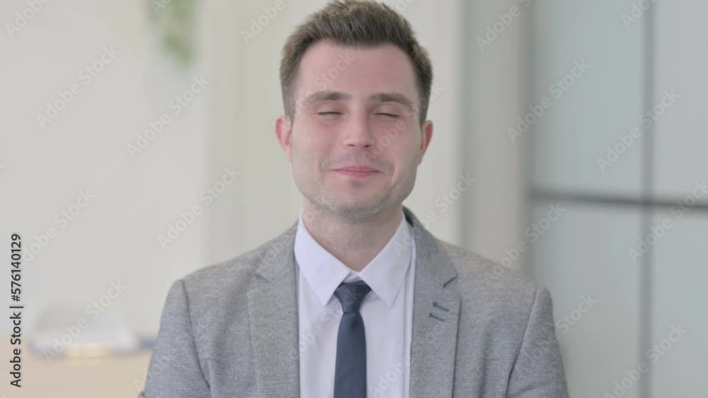 Portrait of Young Businessman showing Thumbs Up Portrait of Young Businessman showing Thumbs Up