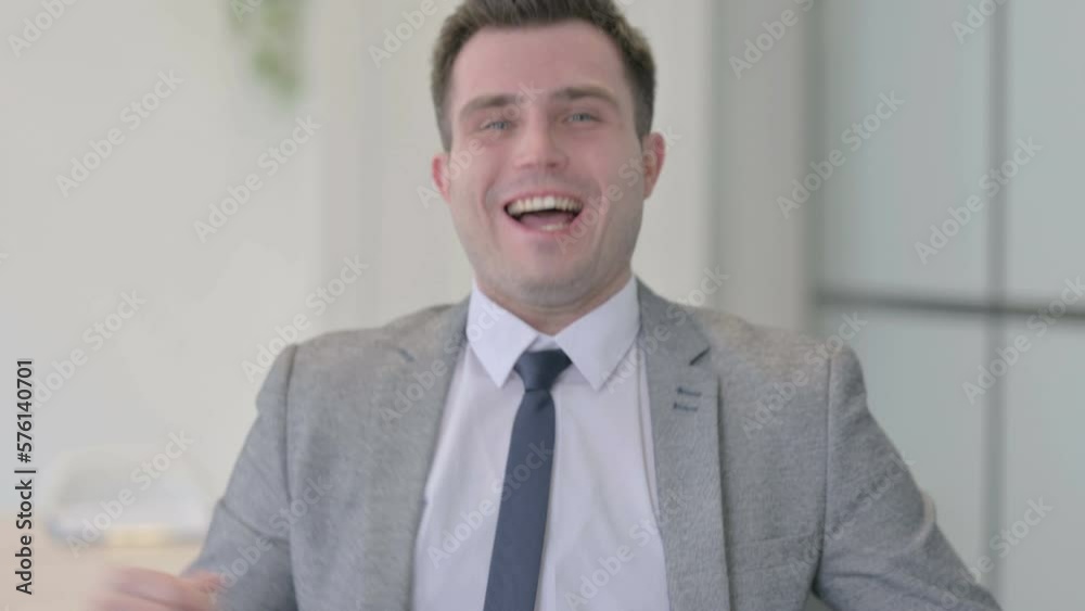 Portrait of Happy Young Businessman Celebrating Success Portrait of Happy Young Businessman Celebrating Success