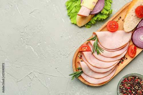 Bild auf Leinwand Board with ingredients for ham sandwich on grey grunge background