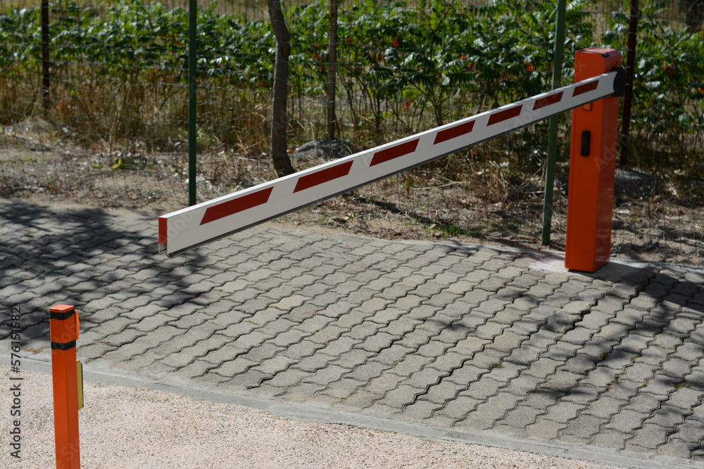 Closed boom barrier on sunny day outdoors Closed boom barrier on sunny day outdoors
