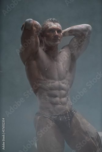 Studio portrait of sexy male model body, nude torso