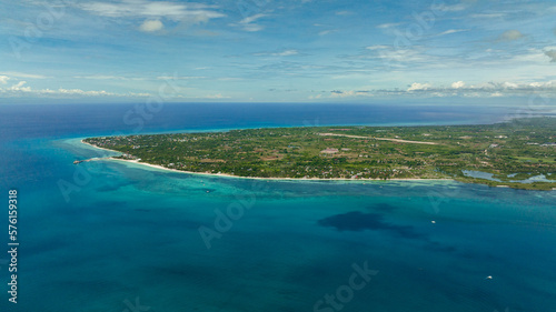 Seascape with tropical island and beach in the sea. Bantayan island, Philippines.