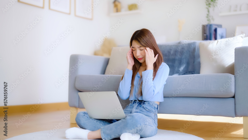 Office syndrome. Overworked tired young asian woman feeling headache, having eyesight problem after computer laptop work. Stressed young woman suffering from fatigue at home Office syndrome. Overworked tired young asian woman feeling headache, having eyesight problem after computer laptop work. Stressed young woman suffering from fatigue at home
