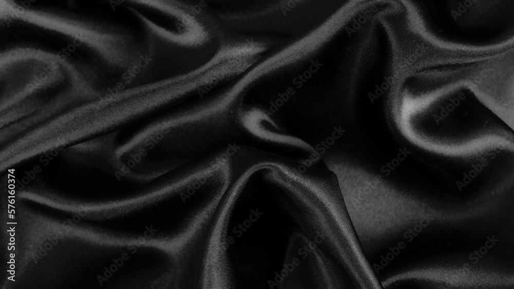 Smooth elegant black silk or satin luxury cloth texture background. Smooth elegant black silk or satin luxury cloth texture background.