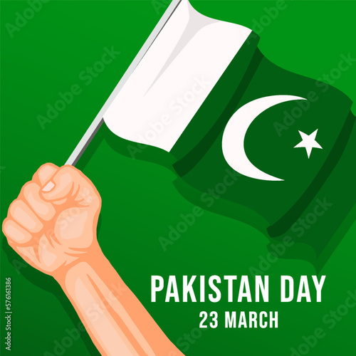 pakistan day design concept with hand holding pakistan flag photo