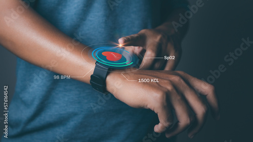 Man using smart watch technology checking heart rate.