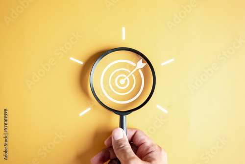 Stampa su tela Magnifier glass focus to target objective with idea creative light bulb icon