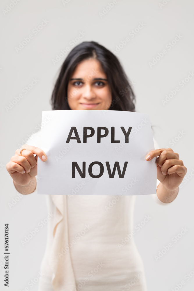 Happy Indian girl invites to apply now (white dress) Happy Indian girl invites to apply now (white dress)