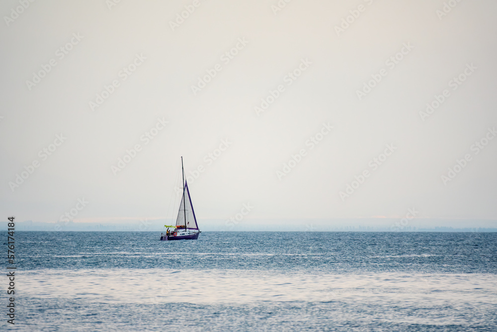 Obraz premium Sailing yacht in the blue calm sea.
