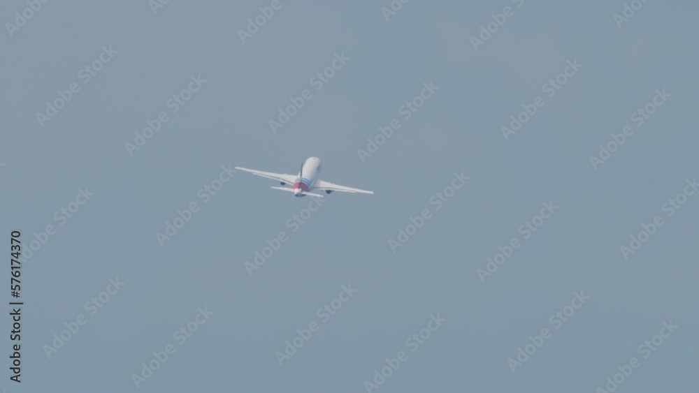 Unrecognizable jet plane in the sky, takeoff and climb. Passenger flight departure. Rear view of an airliner in the sky Unrecognizable jet plane in the sky, takeoff and climb. Passenger flight departure. Rear view of an airliner in the sky