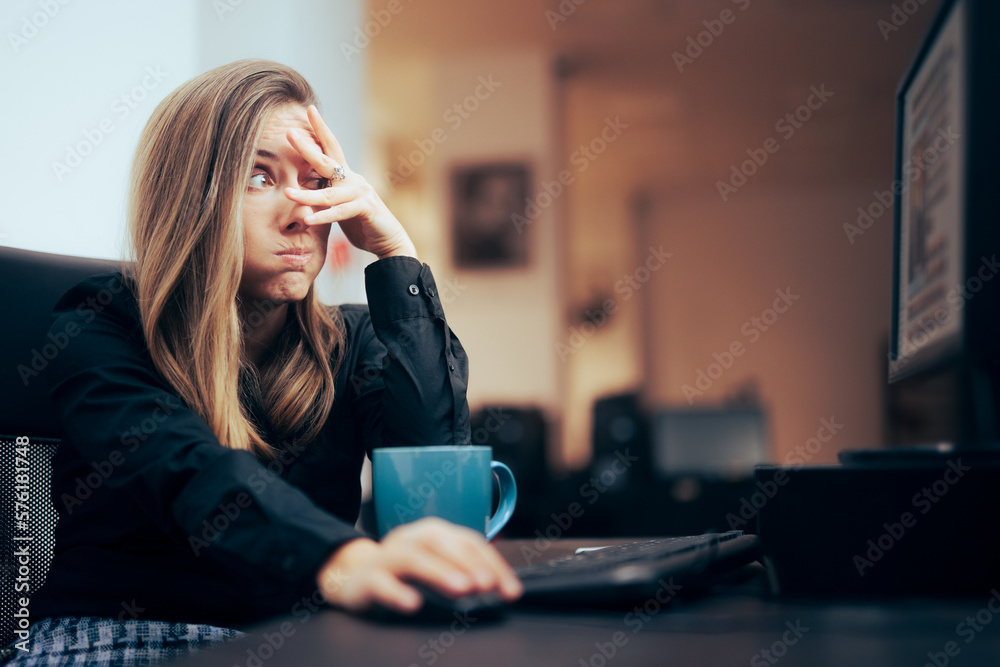 Woman Covering Her Eyes while Browsing the Internet. Content moderator feeling terrified of what she sees 
 - obrazy, fototapety, plakaty 