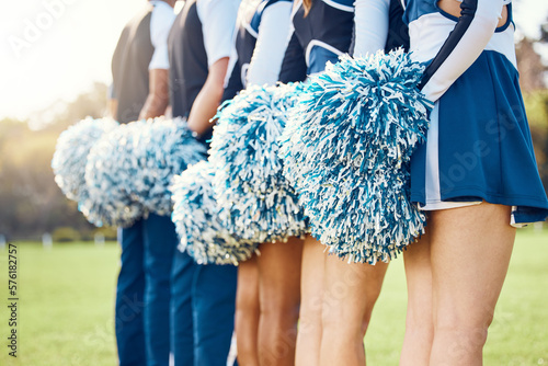Cheerleader pom poms, backs and students in cheerleading uniform on a outdoor field. Athlete group, college sport collaboration and game cheer prep ready for cheering, stunts and fan applause
