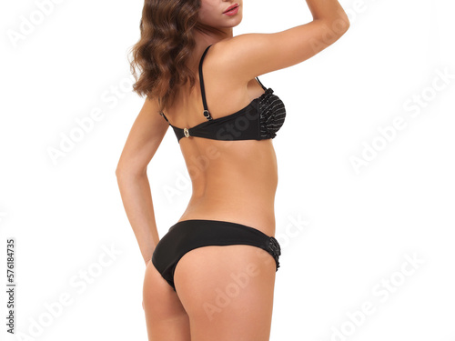 slender woman in swimsuit on white background
