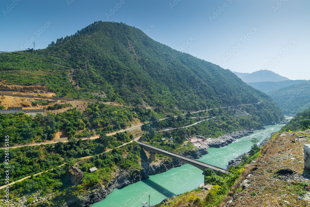 Bridge at Devprayag, Godly Confluence,Garhwal,Uttarakhand, India. Here Alaknanda meets the Bhagirathi river and both rivers thereafter flow on as the Holy Ganges river or Ganga.
