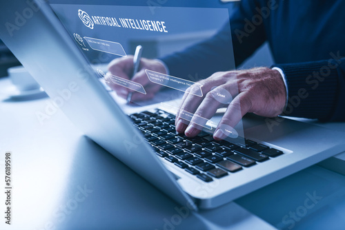 Businessmen Chat with Artificial Intelligence (AI) Chat BOT on a laptop, Man using technology smart robot AI, Futuristic technology transformation.