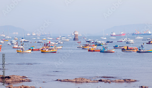 Canvas Print Colorful fishing boats near the shore of dirty water of Arabian sea at amazing s