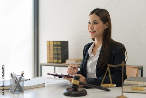 Legal and justice concept, Female lawyer writing contract about regulation and working in law firm