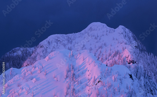 Pink snow covered mountains in sunset. Whistler Blackcomb ski resort. British Columbia. Canada.  photo