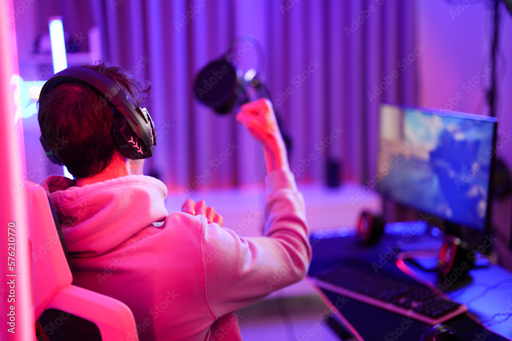 Caucasian young player man watching streaming video game while enjoy and cheer champion team to win the match challenge Caucasian young player man watching streaming video game while enjoy and cheer champion team to win the match challenge