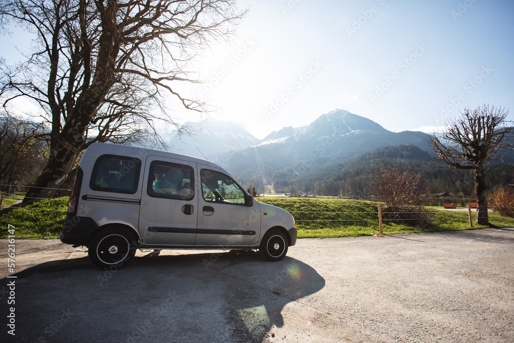 Fototapeta premium A self-built camper that stands at the foot of a mountain in which you can sleep and ride. A small camper.