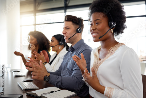 Business people  call center and consulting on computer in telemarketing  customer service or support at office. Group of marketing team  consultant or agent talking in contact us for online advice