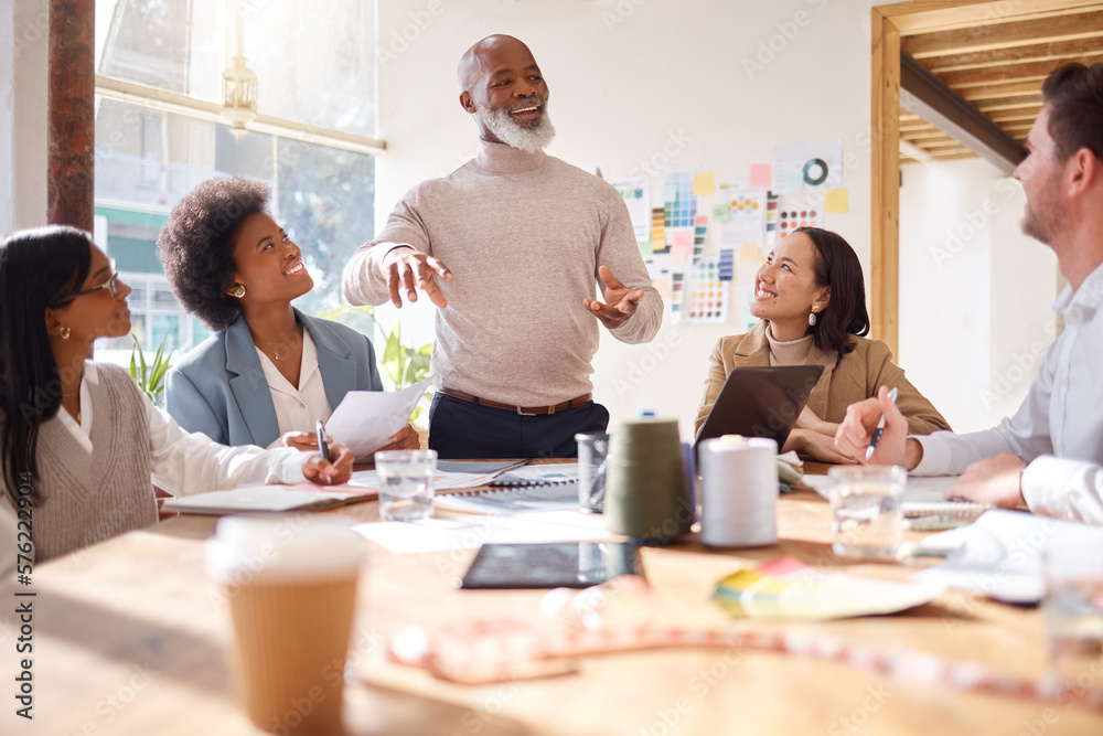 Fototapeta premium Creative business people, meeting and planning in fashion design, brainstorming or strategy at office. Senior, black man or CEO talking to team of designers in teamwork collaboration for startup