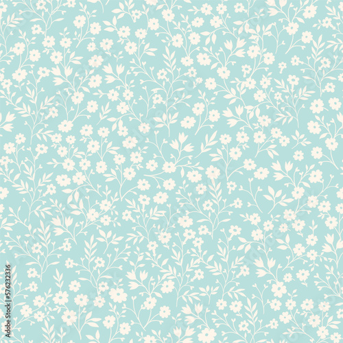 Vintage seamless tiny floral pattern. Turquoise background with small light yellow flowers. Design for wallpaper, clothing, packaging, fabric, cover, textiles