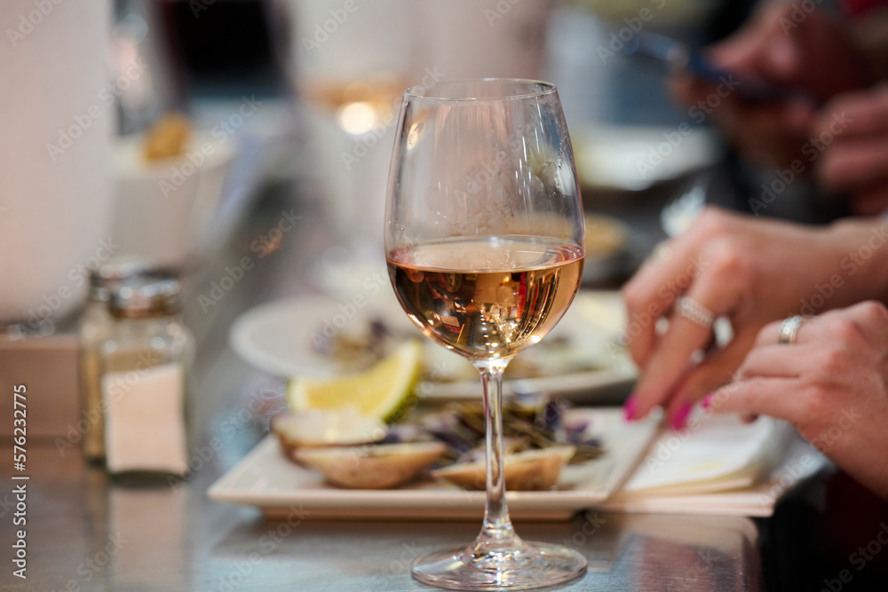 one glass of rose wine in a tapas restaurant in Malaga, Spain