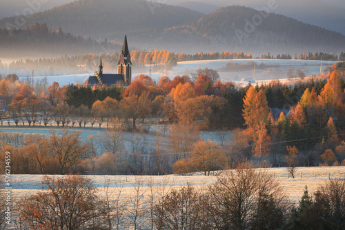 autumn frosty morning overlooking the church in the valley