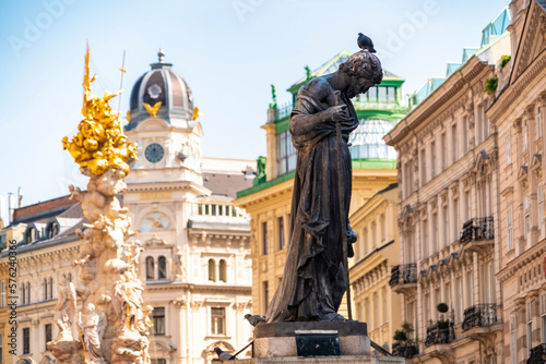 The PestsaÃ¤ule and a statue of a priest near Stephan's square photo
