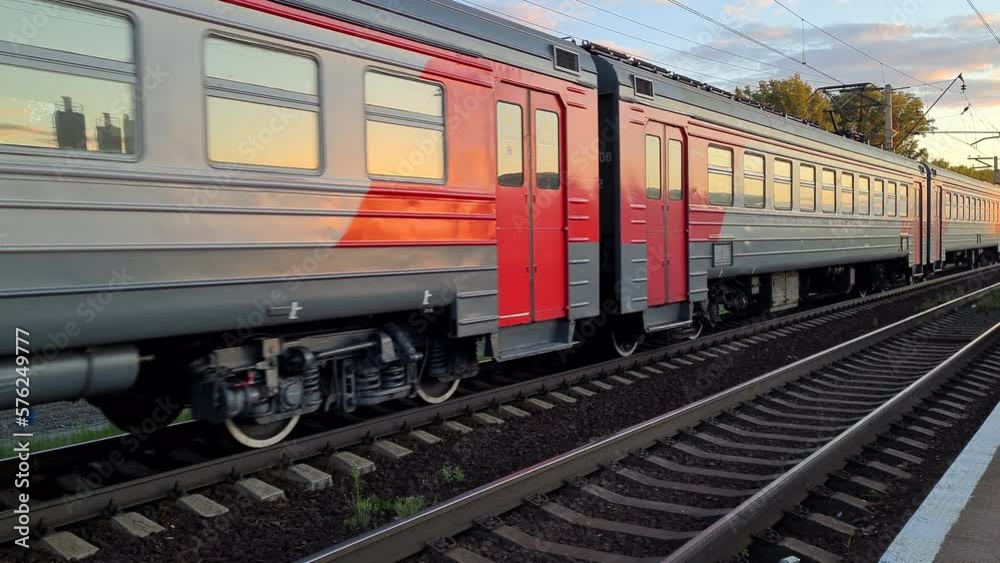 Electric passenger train passing through railway track. Electric passenger train passing through railway track.